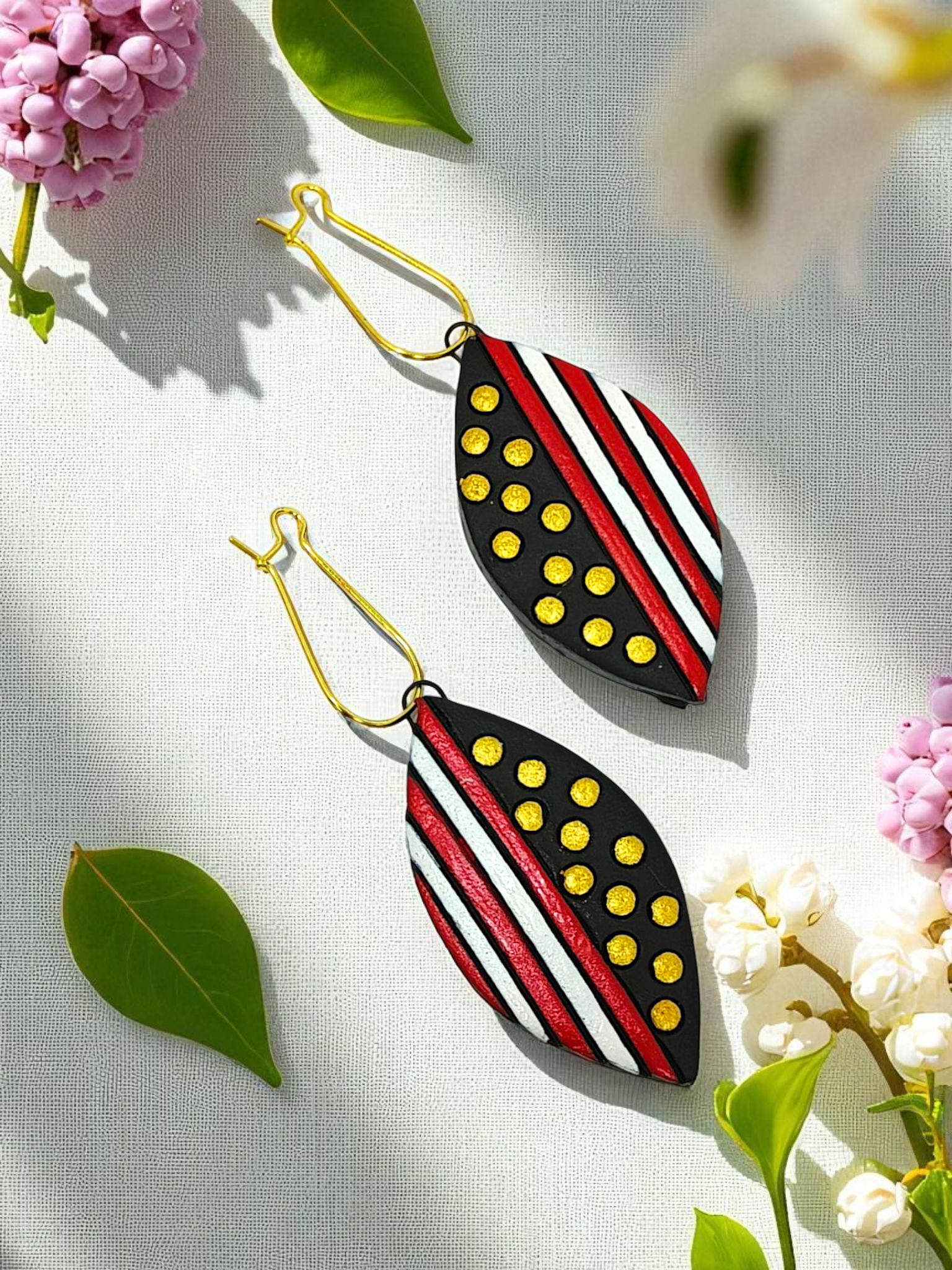 Black Trible jewelry Necklace Set featuring black, red, white, and yellow patterned leaf-shaped earrings