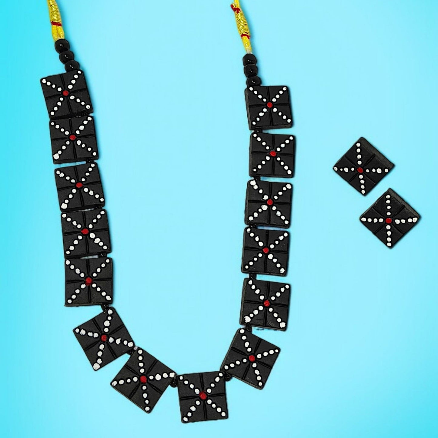 Handmade Black Beaded Necklace Set with geometric black beads and white dot accents on yellow string