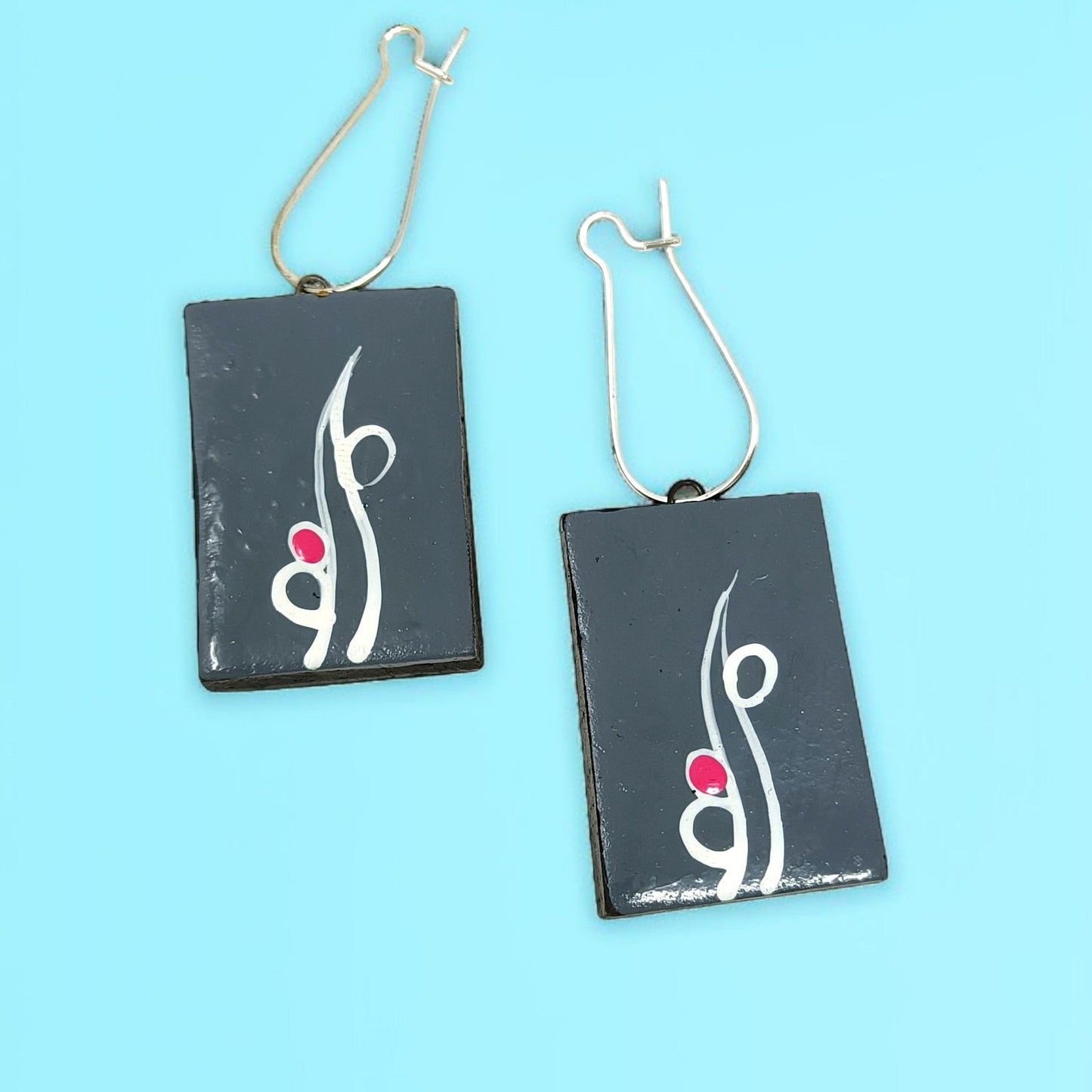 Handmade tribal necklace for women featuring black rectangular pendants with white and red design