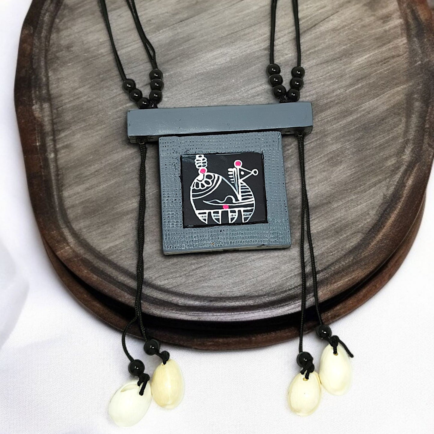 Handmade tribal necklace for women with black cord and artistic pendant with shell charms