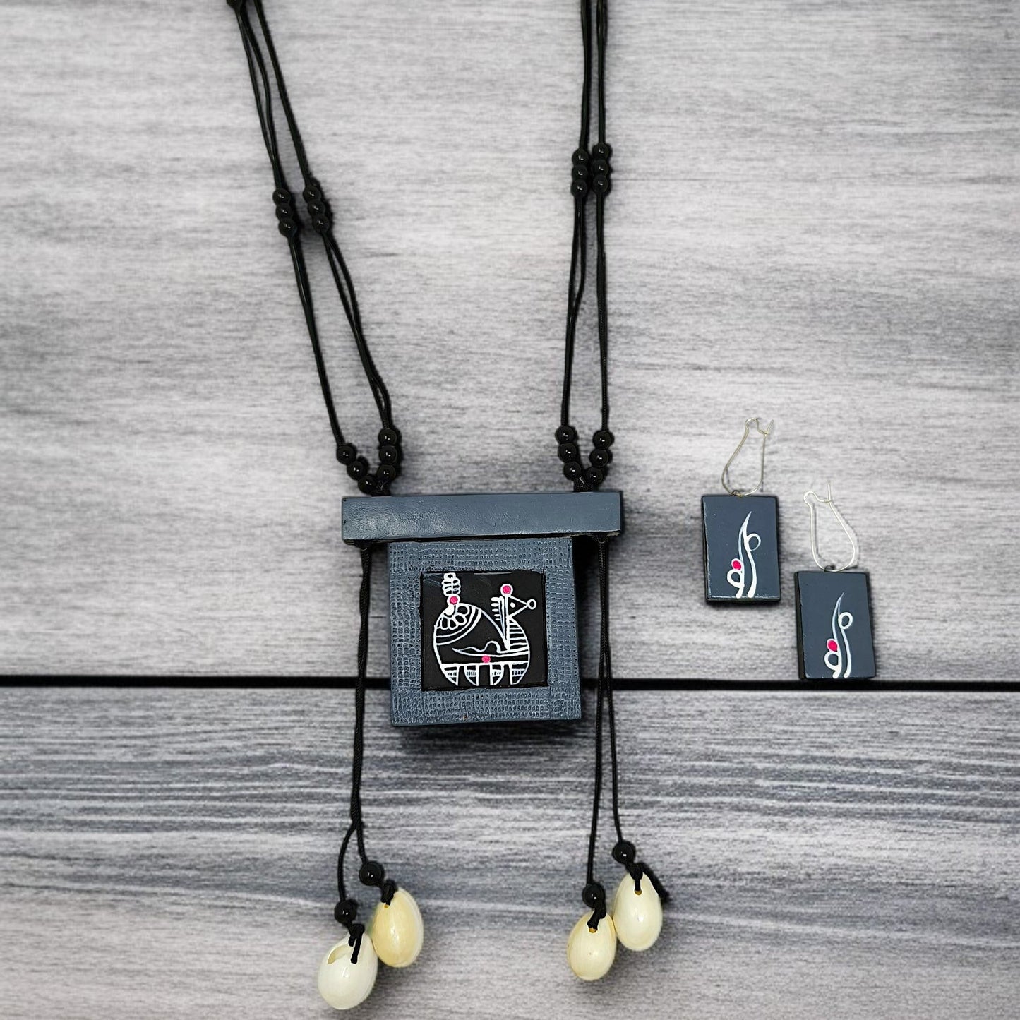 Handmade tribal necklace for women with black pendant and matching earrings by ASTRIA JEWELLERY