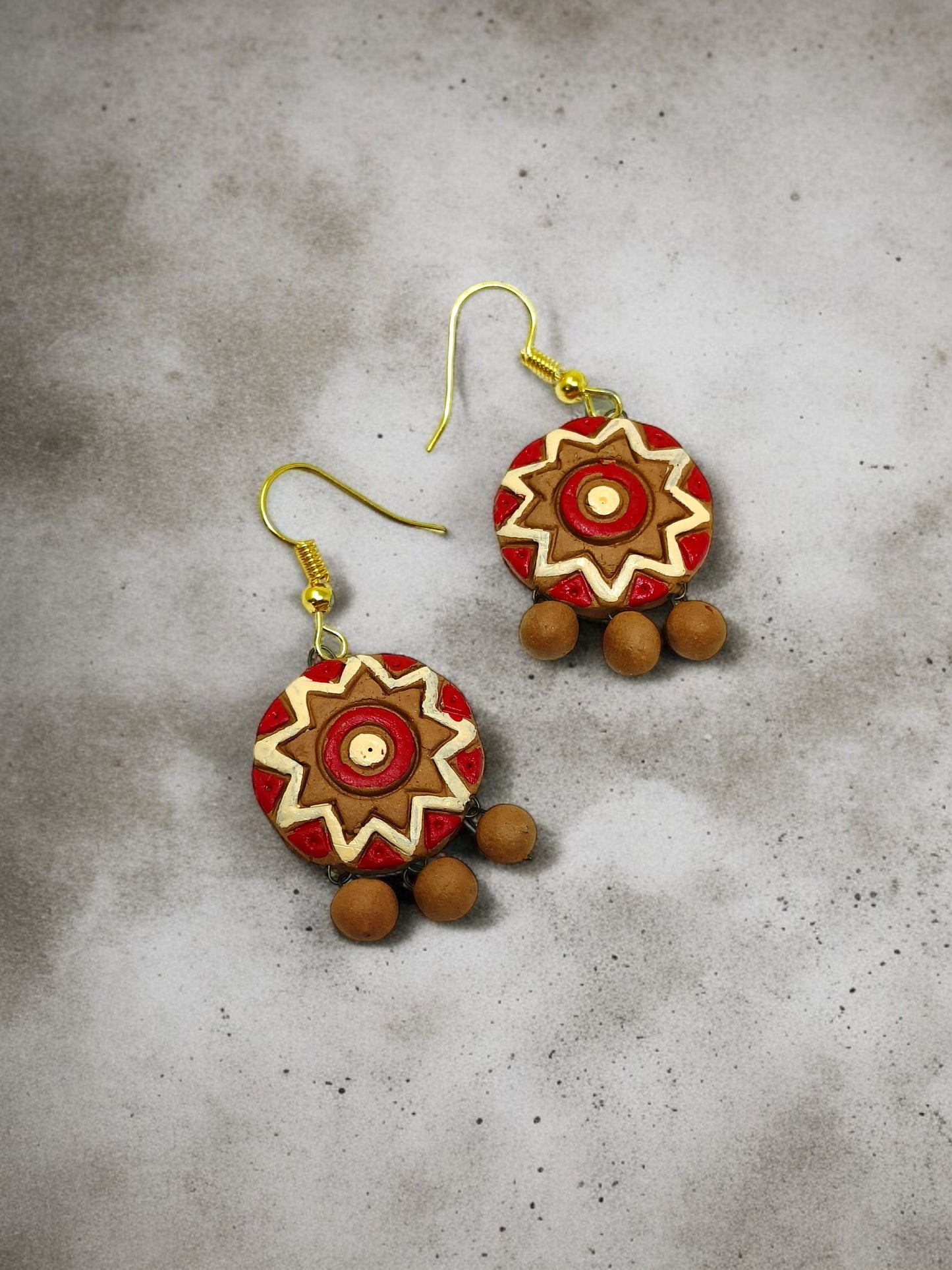 Unique Handmade Dokra Tribal Jewellery Online featuring red and beige round earrings with wooden beads