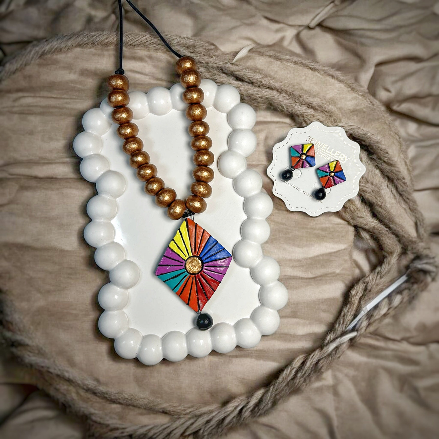 Colorful modern ethnic pendants for women necklace with matching earrings on white decorative tray