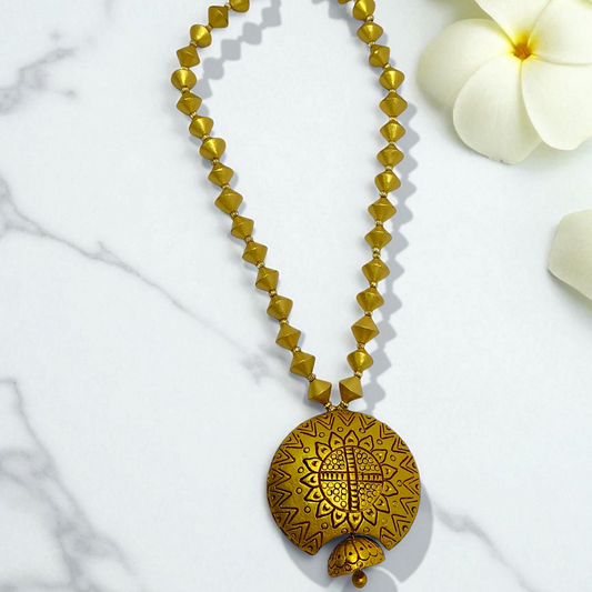 Bishnupur Handpainted Terracotta Necklace Set with geometric bead design and floral pendant on marble background