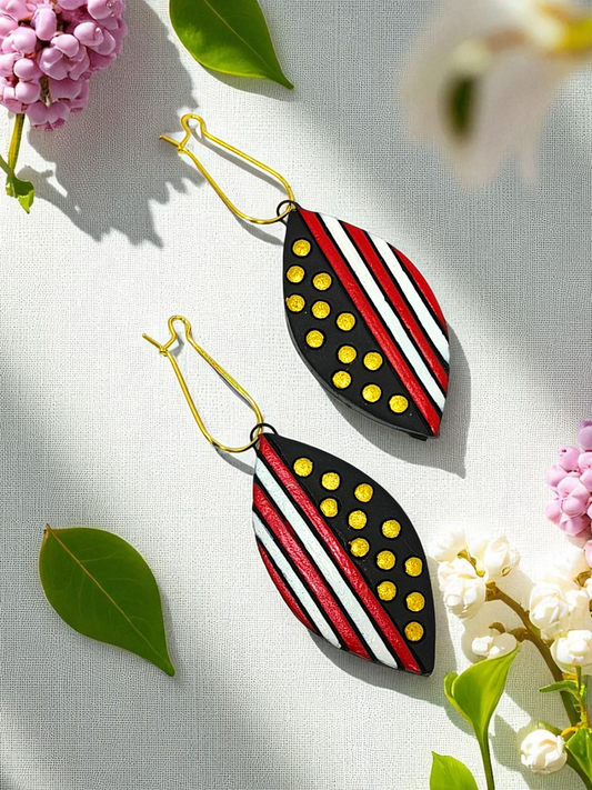 Black Trible jewelry Necklace Set featuring black, red, white, and yellow patterned leaf-shaped earrings
