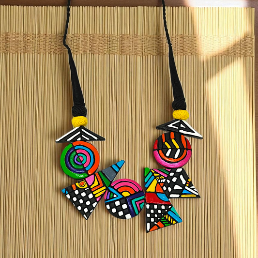 Hand made Geometrical Terracotta Necklace Set featuring colorful geometric shapes and patterns on a black cord