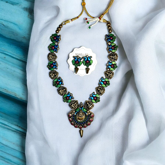Handmade Artisan Peacock Charm Necklace and Earring Jewelry with colorful blue green and pink details from Mrritika