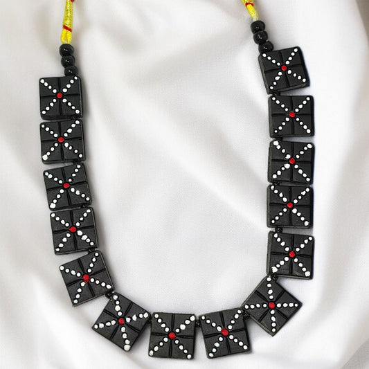 Handmade Black Beaded Necklace Set with square black beads featuring white and red dot patterns on yellow string