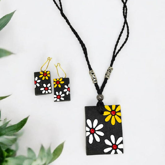 Handmade floral necklace set with black cord and colorful daisy flower pendant and matching earrings