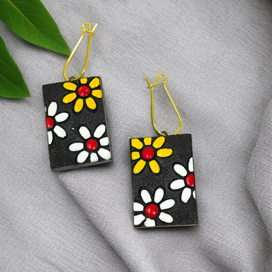 Handmade floral necklace set featuring black rectangular earrings with yellow and white flower designs by ASTRIA JEWELLERY