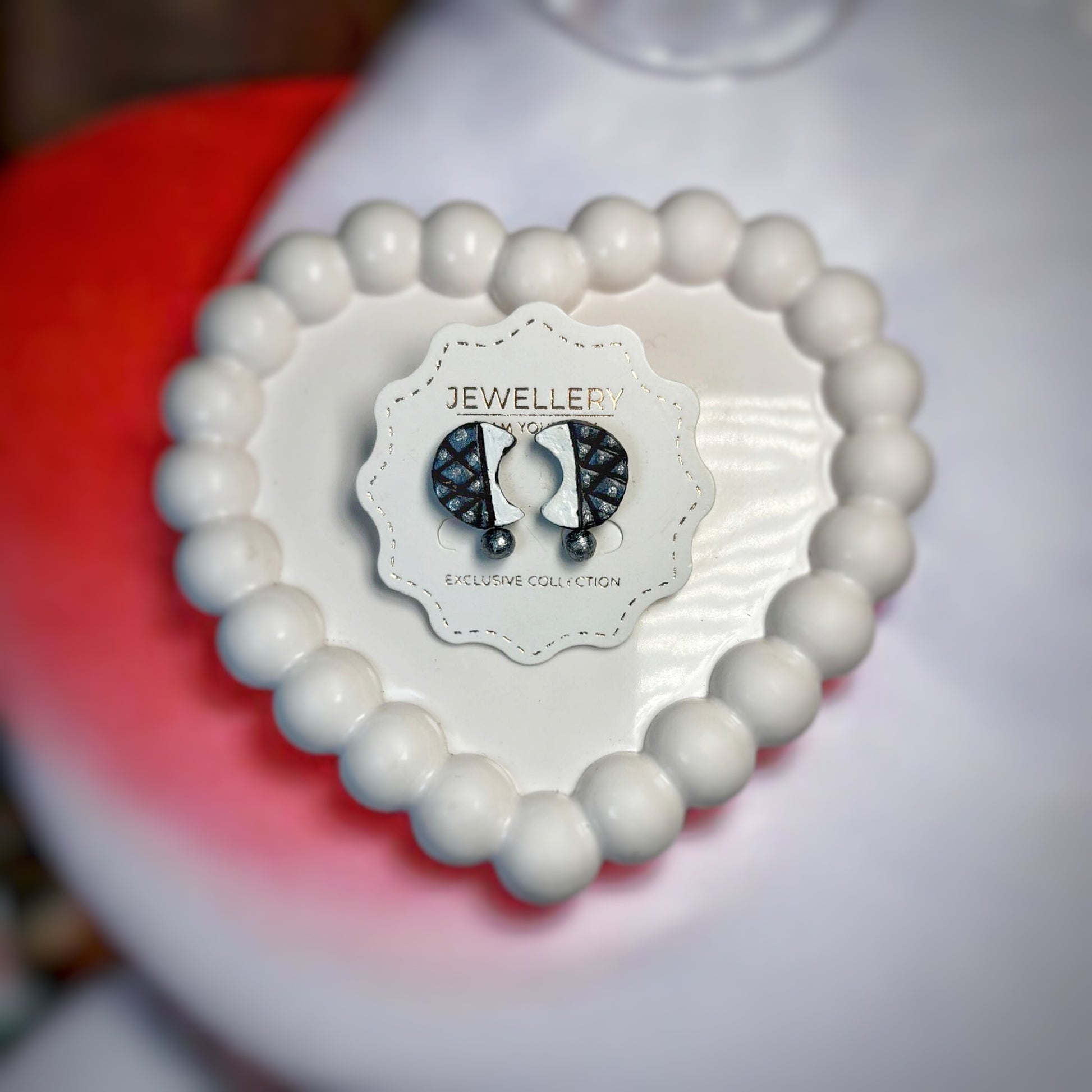 Handmade Half Circle Moon Earrings Terracotta Jewelry displayed on white card inside heart-shaped beaded decor