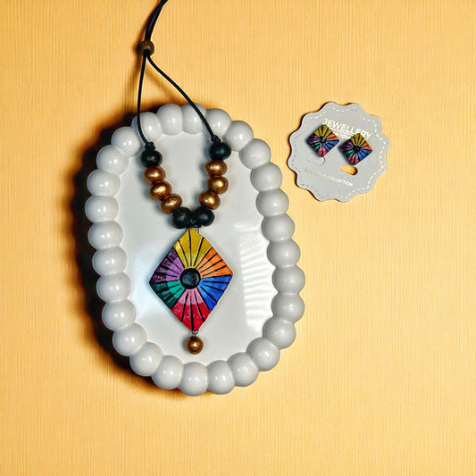Colorful handmade kite necklace with matching earrings by ASTRIA JEWELLERY displayed on white beads 