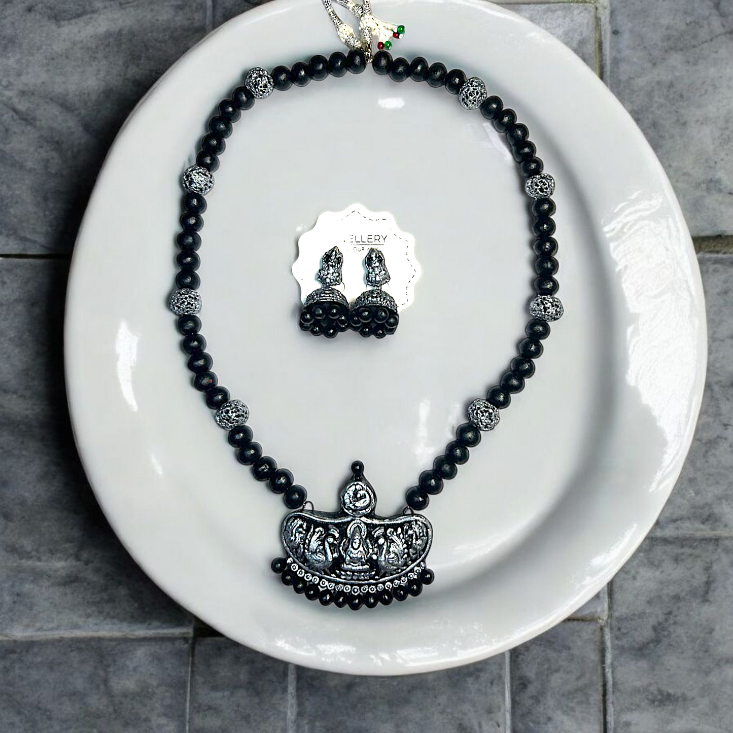 Handmade Temple Jewelry Set featuring black beads and intricate silver pendant with matching earrings by ASTRIA JEWELLERY