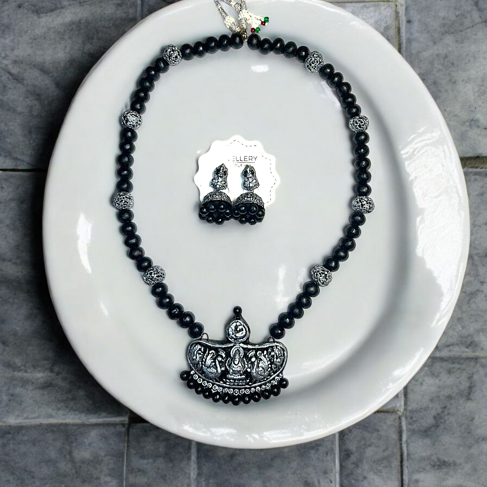 Handmade Temple Jewelry Set featuring black beads and intricate silver pendant with matching earrings by ASTRIA JEWELLERY