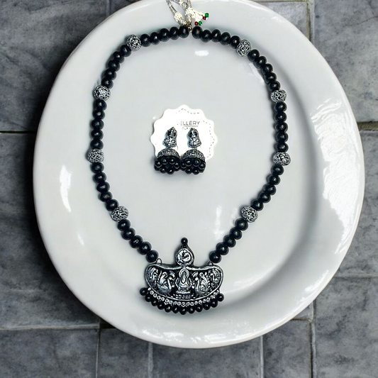 Handmade Temple Jewelry Set featuring black beads and intricate silver pendant with matching earrings by ASTRIA JEWELLERY