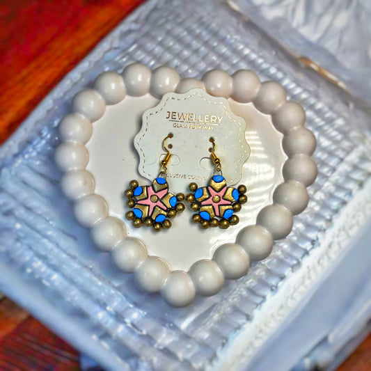 Handmade traditional earrings by Mrritika By Astria Jewellery with colorful floral design and bead accents