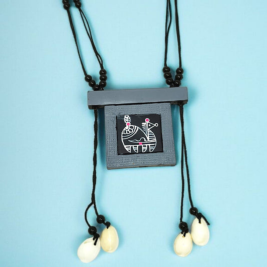 Handmade tribal necklace for women with black pendant and white shell charms on black cord