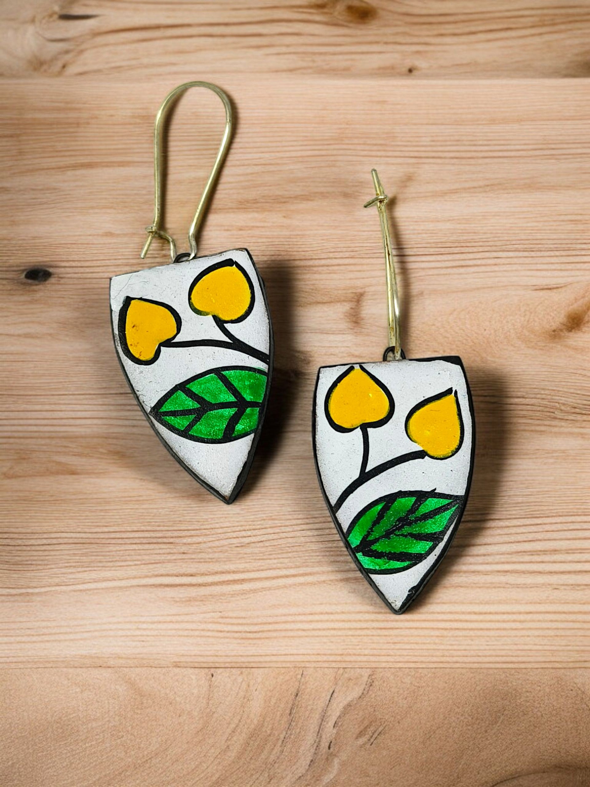 Indian Artisan Birds Print Handmade Necklace Set I Terracotta Pendent and Earring with yellow and green leaf design on wooden background