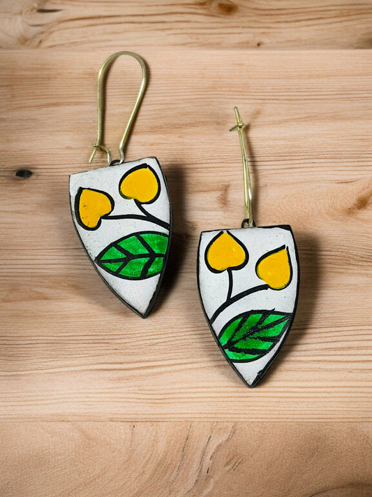 Indian Artisan Birds Print Handmade Necklace Set I Terracotta Pendent and Earring with yellow and green leaf design on wooden background