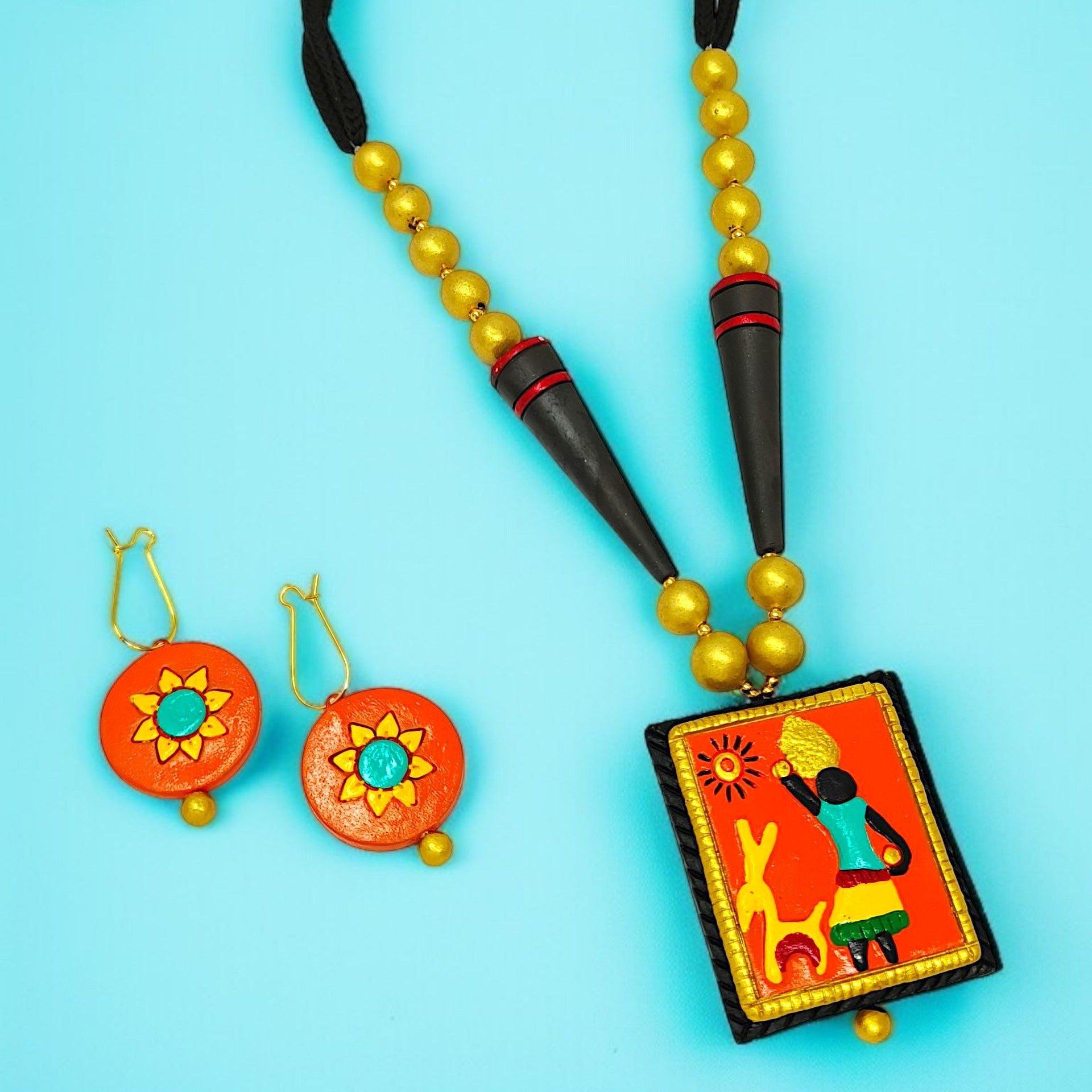 Indian Ethnic Pendent Necklace Set for Women with vibrant orange and yellow handcrafted pendant and matching earrings