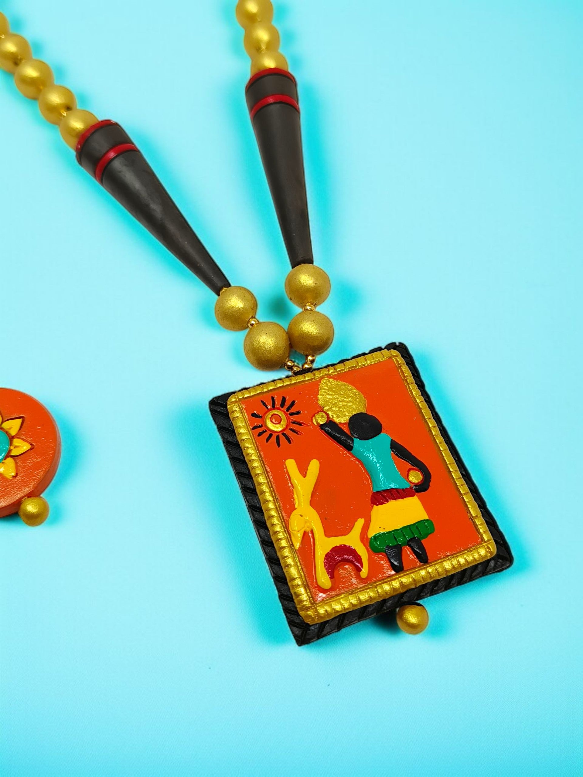 Indian Ethnic Pendent Necklace Set for Women with colorful tribal art design and golden beads