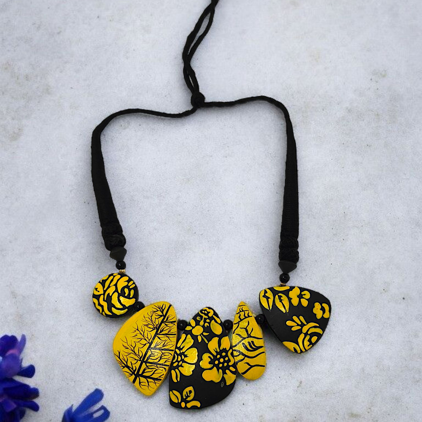 Mrittika Handmade Tribal Clay Choker With Earring featuring yellow and black floral design on adjustable black string