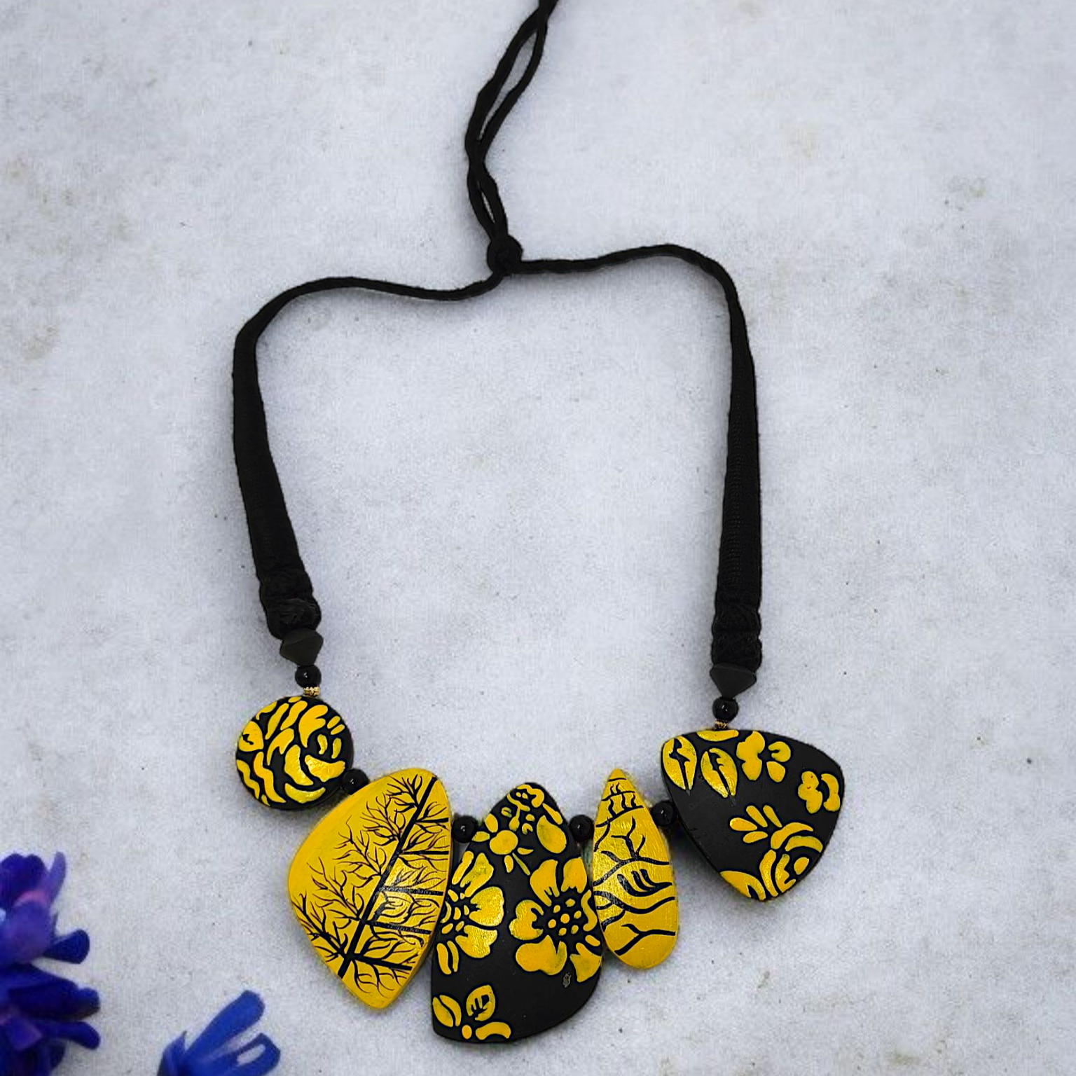 Mrittika Handmade Tribal Clay Choker With Earring featuring yellow and black floral design on adjustable black string