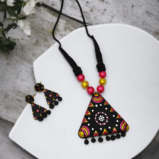 Tringle Terracotta Jewelry Set geometric pendant and earrings with black, pink, and gold accents by Mrritika