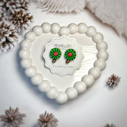 Unique handmade Earrings Green Red displayed on white card inside heart-shaped white bead container by Mrritika