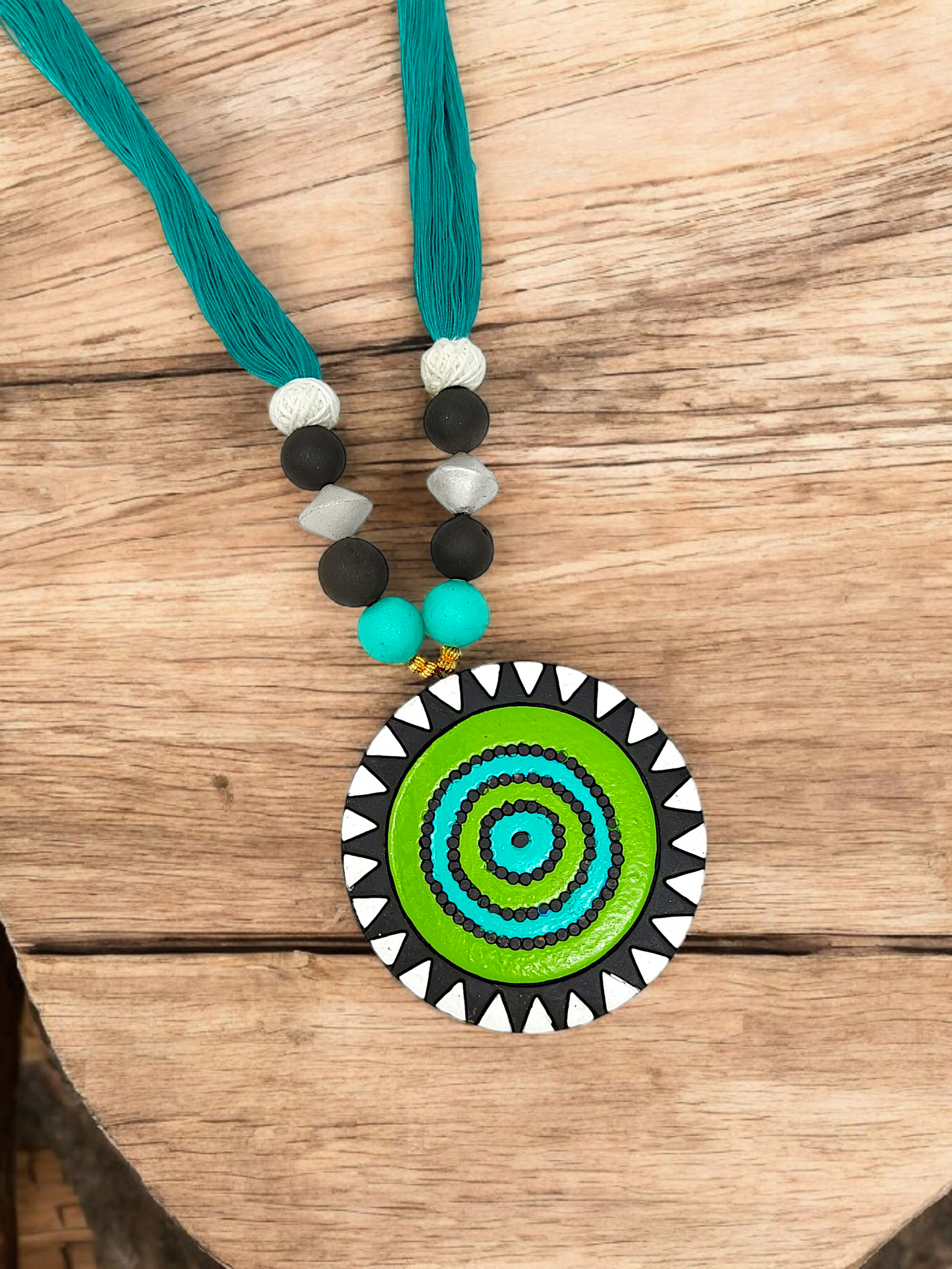 Unison Green Sun Terracotta Pendant with Earring featuring vibrant green circular design and teal thread necklace by ASTRIA JEWELLERY