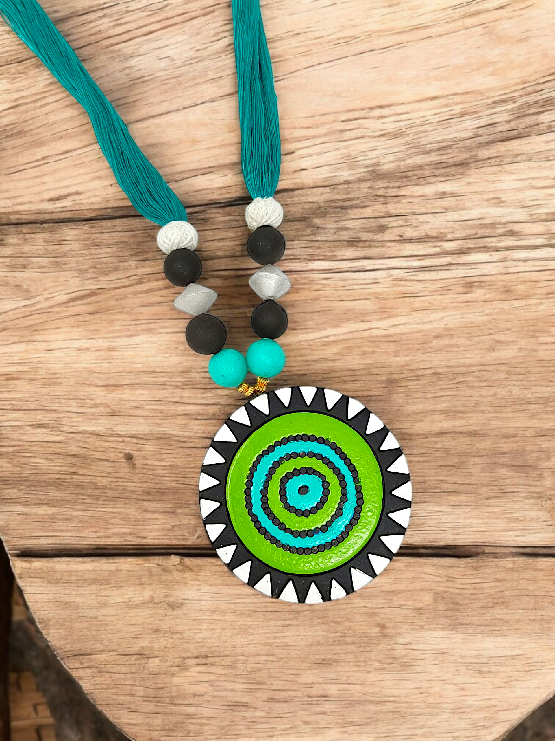 Unison Green Sun Terracotta Pendant with Earring featuring vibrant green circular design and teal thread necklace by ASTRIA JEWELLERY