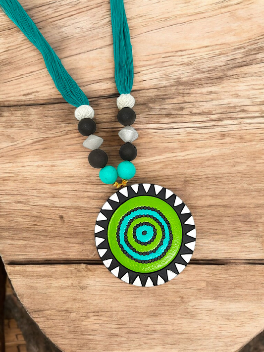 Unison Green Sun Terracotta Pendant with Earring featuring vibrant green circular design and teal thread necklace by ASTRIA JEWELLERY