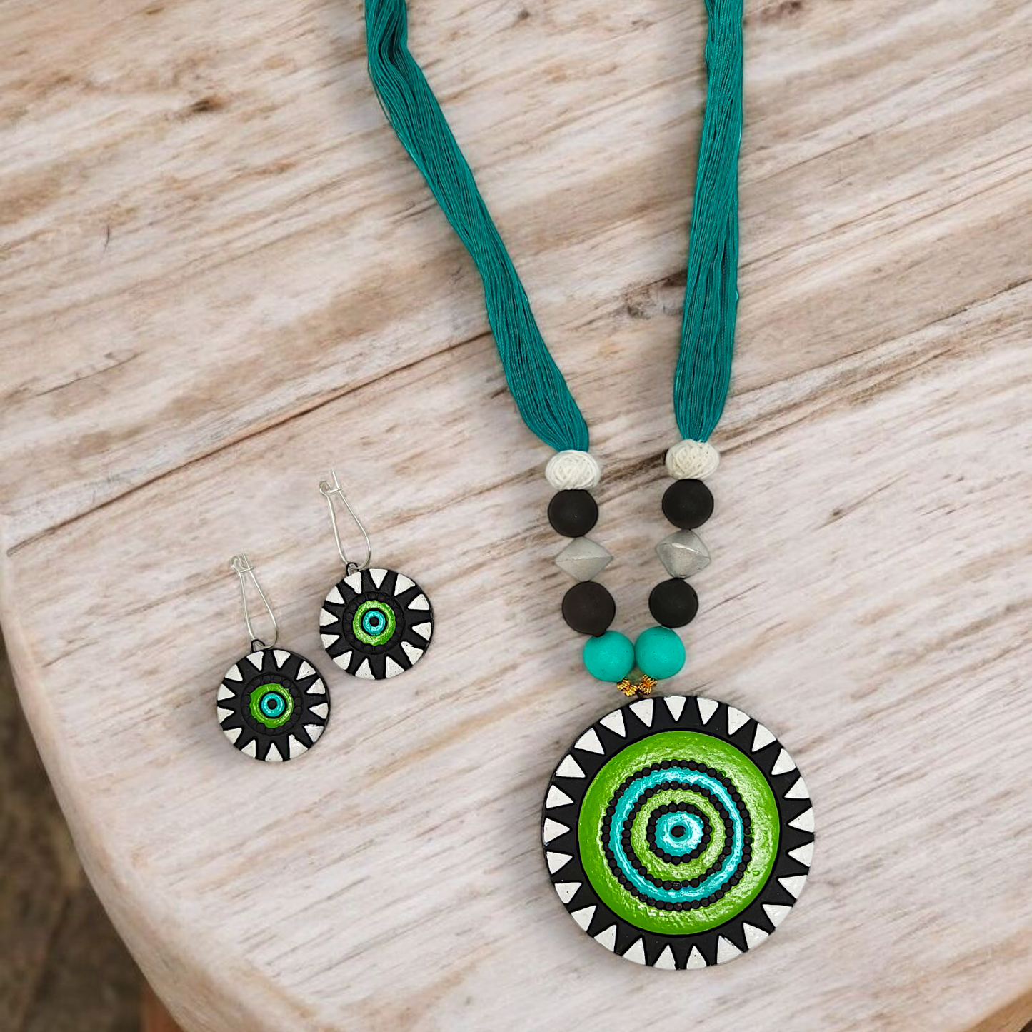 Unison Green Sun Terracotta Pendant with Earring featuring vibrant green sun design on necklace and matching earrings
