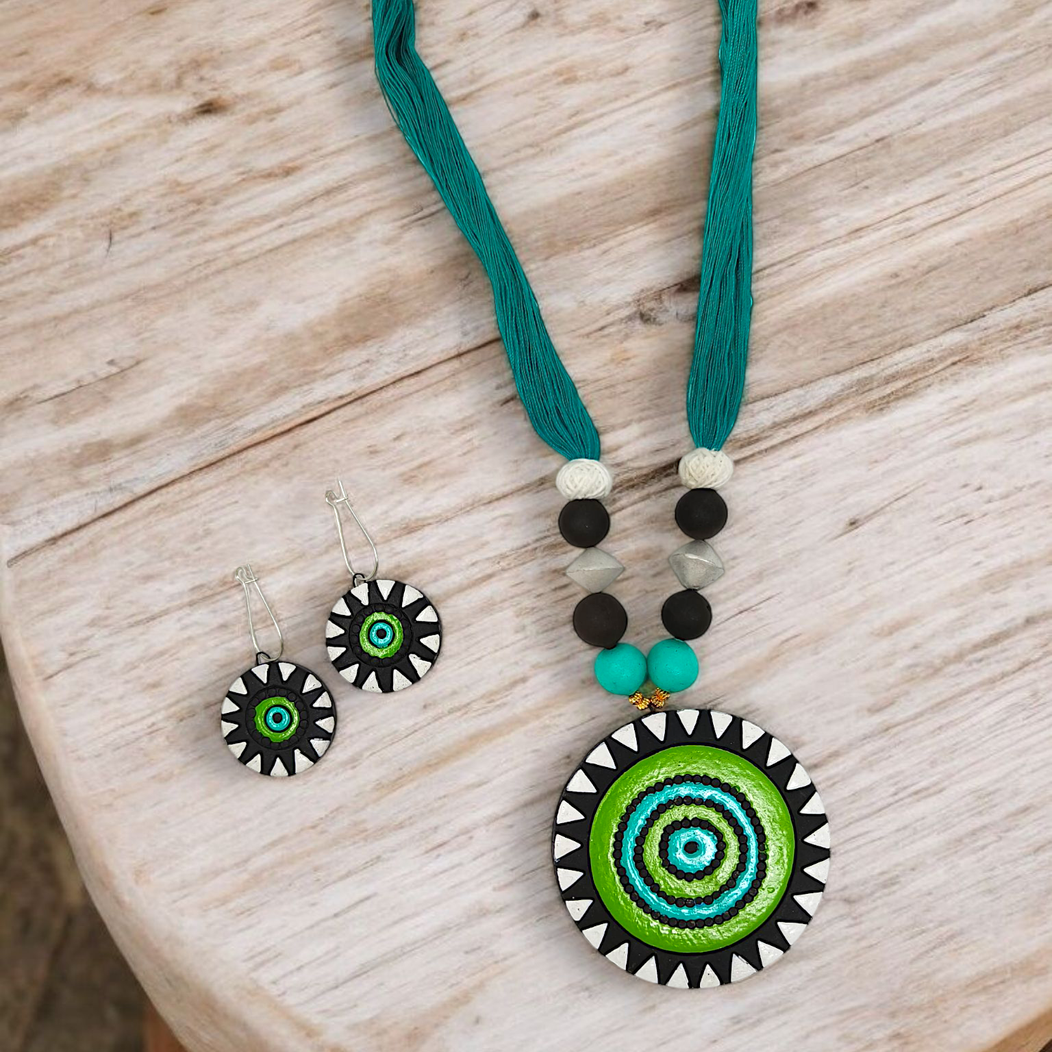 Unison Green Sun Terracotta Pendant with Earring featuring vibrant green sun design on necklace and matching earrings