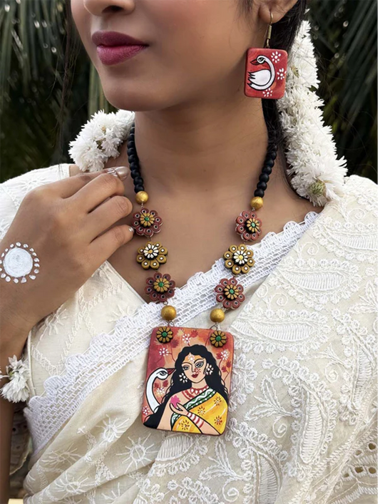 Vagdevi Hand-painted Terracotta Jewelry Set with floral beads and artistic pendant worn with traditional outfit
